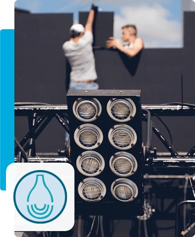 Aulitec during setup and technical work on screens and lighting – with Aulitec logo